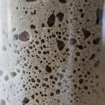 Macro close-up of an active sourdough starter full of fermentation bubbles